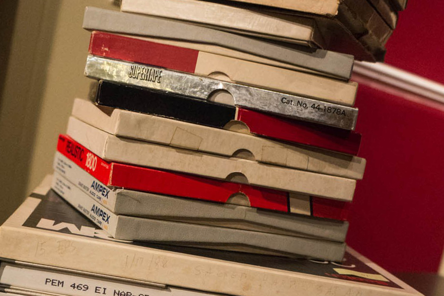 A stack of amateur recordings of Sacred Harp singings on open reel tapes.